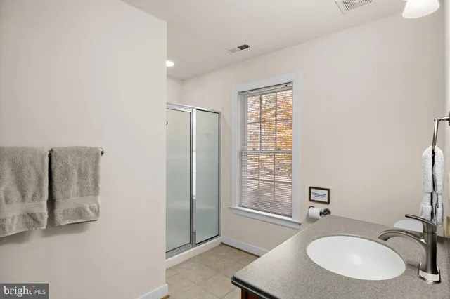 a view of a dining room with furniture and a window