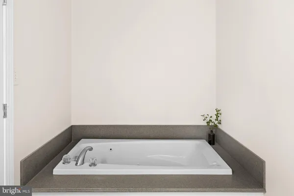 a bedroom with furniture and a fireplace