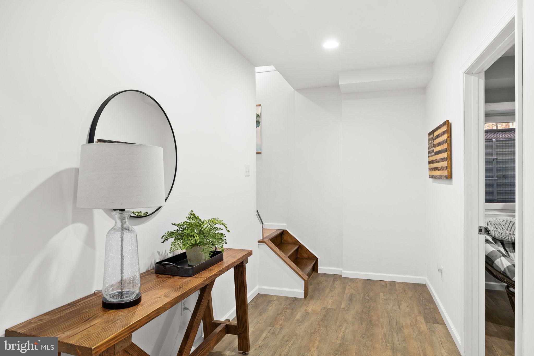 14 Oak Road Bumpass, VA 23024 - Photo 43 of 75 a view of a hallway with wooden floor and a potted plant