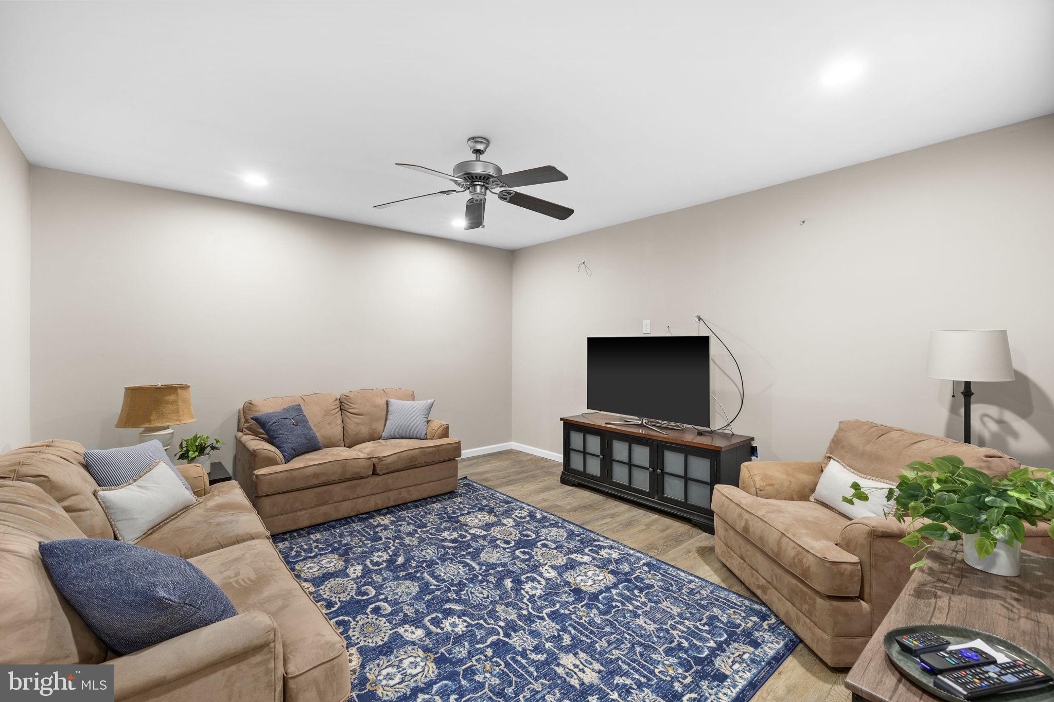 14 Oak Road Bumpass, VA 23024 - Photo 44 of 75 a living room with furniture and a flat screen tv