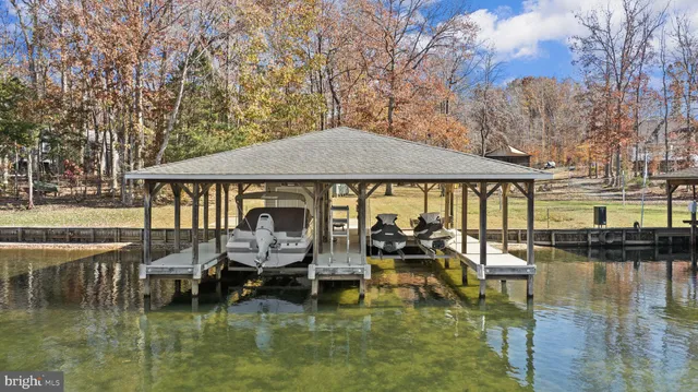 a view of a swimming pool with outdoor seating