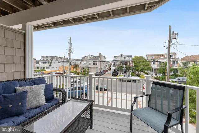 a view of a balcony with furniture