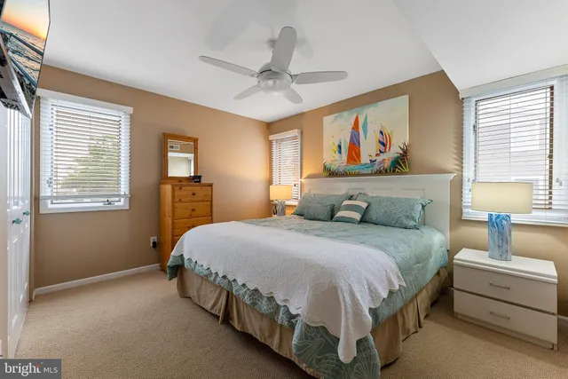 a spacious bedroom with a bed and window