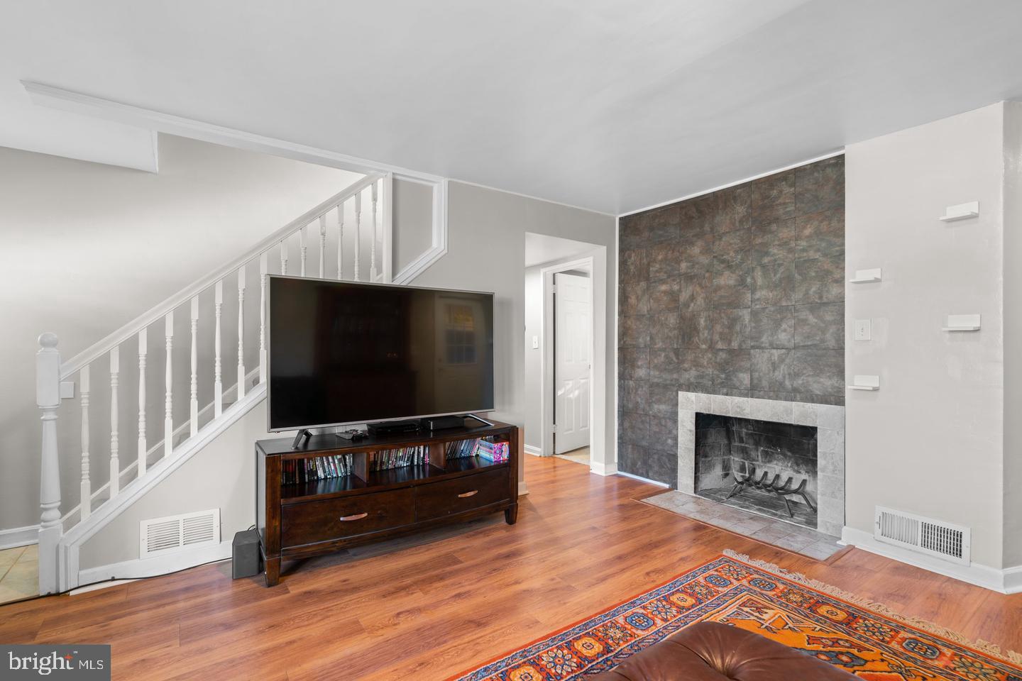 12908 Estelle Road Silver Spring, MD 20906 - Photo 5 of 19 a living room with furniture and a flat screen tv
