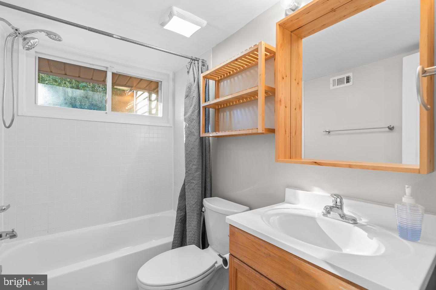 12908 Estelle Road Silver Spring, MD 20906 - Photo 8 of 19 a bathroom with a sink toilet and shower
