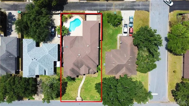 an aerial view of a house with outdoor space