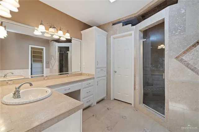 a bathroom with a sink double vanity and a mirror