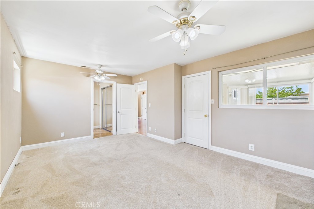 10002 St Elizabeth Circle Cypress, CA 90630 - Photo 14 of 35 a view of a livingroom with a ceiling fan and window