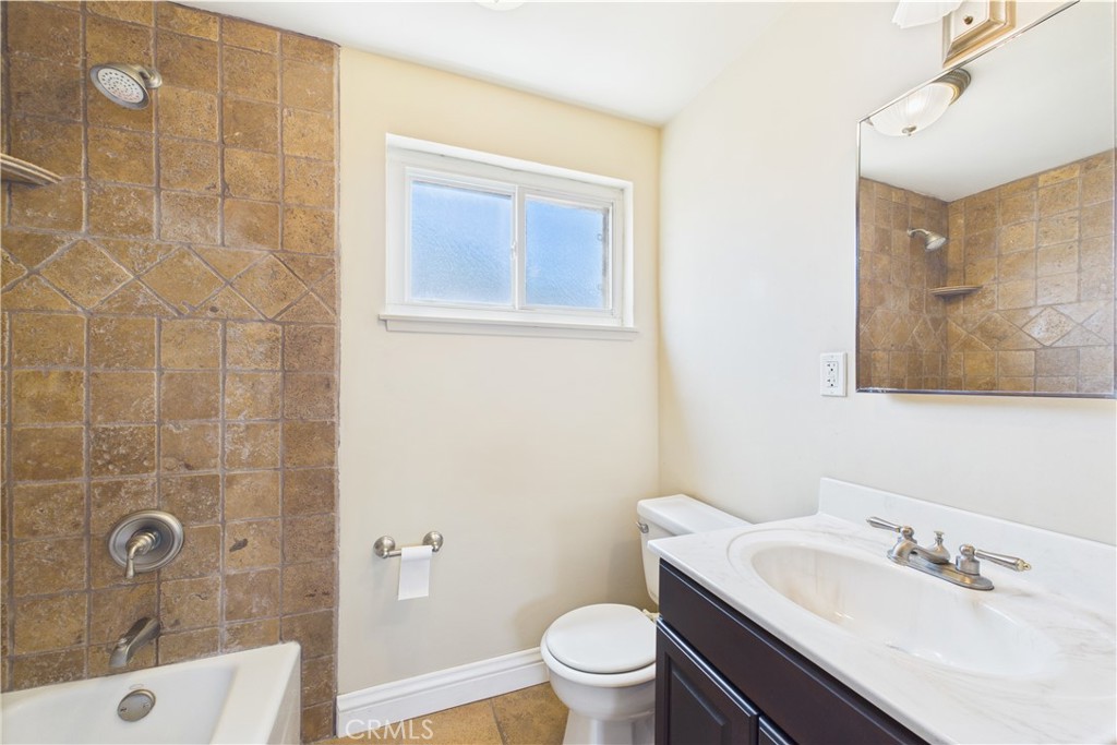 10002 St Elizabeth Circle Cypress, CA 90630 - Photo 16 of 35 a bathroom with a sink a toilet and shower
