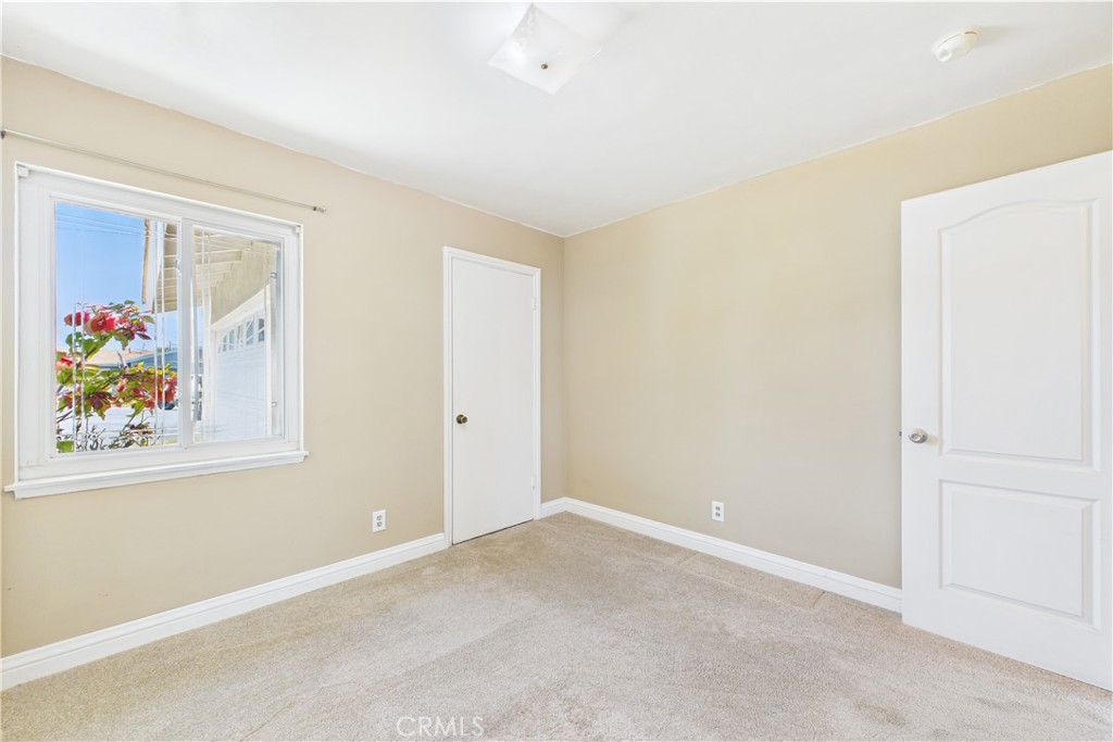 10002 St Elizabeth Circle Cypress, CA 90630 - Photo 19 of 35 an empty room with painting on the wall
