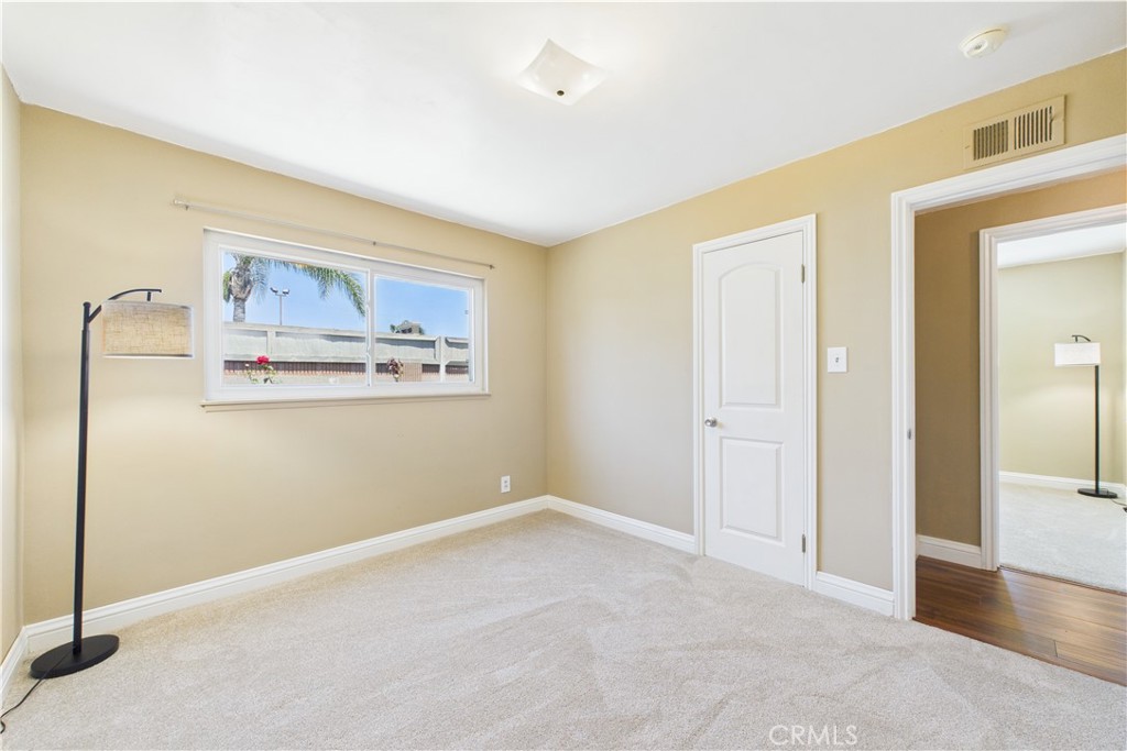 10002 St Elizabeth Circle Cypress, CA 90630 - Photo 23 of 35 a view of a hallway with wooden floor