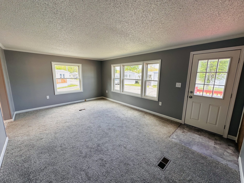 93 Grochmal Avenue, Unit 119 Springfield, MA 01151 - Photo 13 of 33 an empty room with windows
