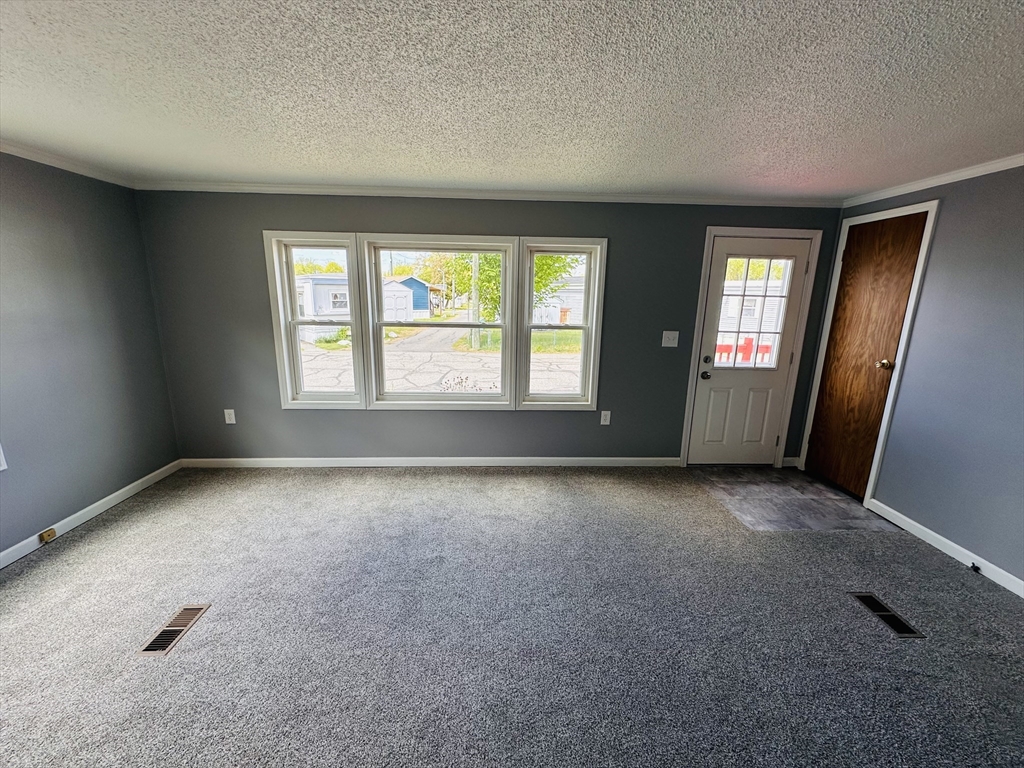 93 Grochmal Avenue, Unit 119 Springfield, MA 01151 - Photo 14 of 33 an empty room with windows