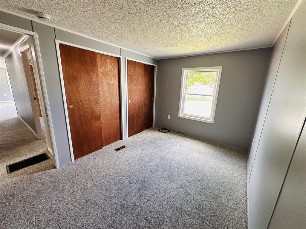 93 Grochmal Avenue, Unit 119 Springfield, MA 01151 - Photo 25 of 33 an empty room with windows