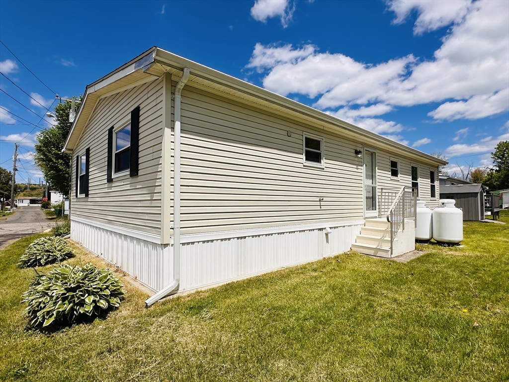 93 Grochmal Avenue, Unit 119 Springfield, MA 01151 - Photo 29 of 33 a front view of a house with a yard