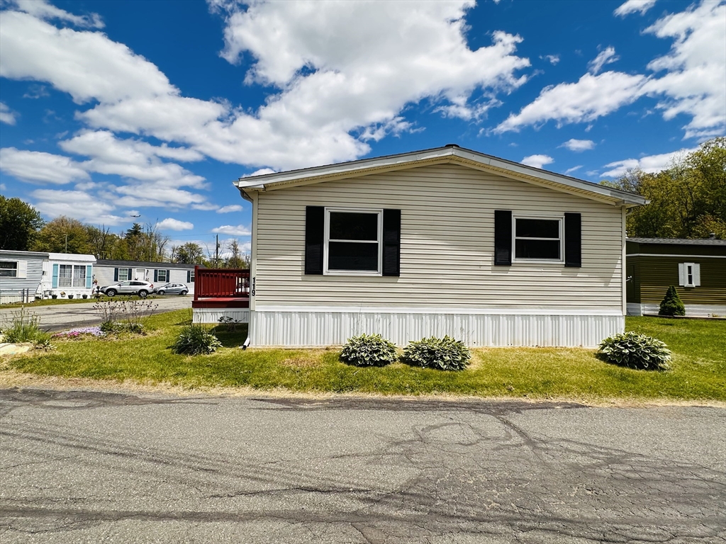 93 Grochmal Avenue, Unit 119 Springfield, MA 01151 - Photo 30 of 33 a front view of a house with a yard