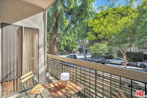 a view of balcony with wooden floor and outdoor space