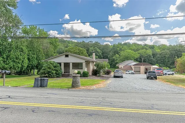 a view of a street with a car parked