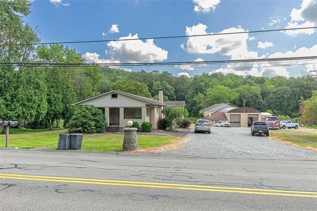 a view of a street with a car parked