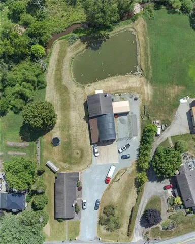 an aerial view of a house with outdoor space