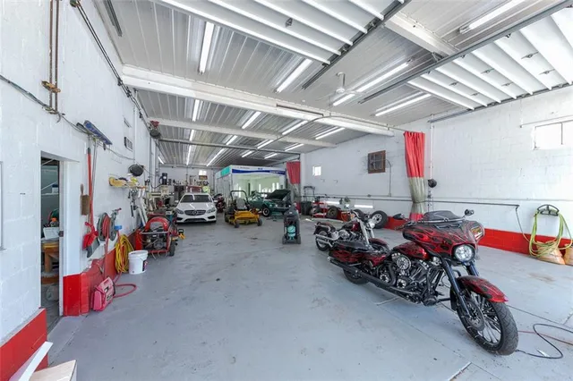 a view of a garage with rack and bicycle
