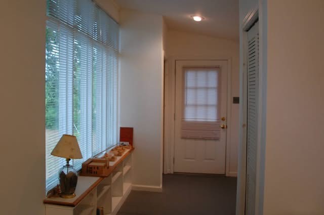 143 Davis Road Bedias, TX 77831 - Photo 6 of 8 a room that has a bed and a chair in it