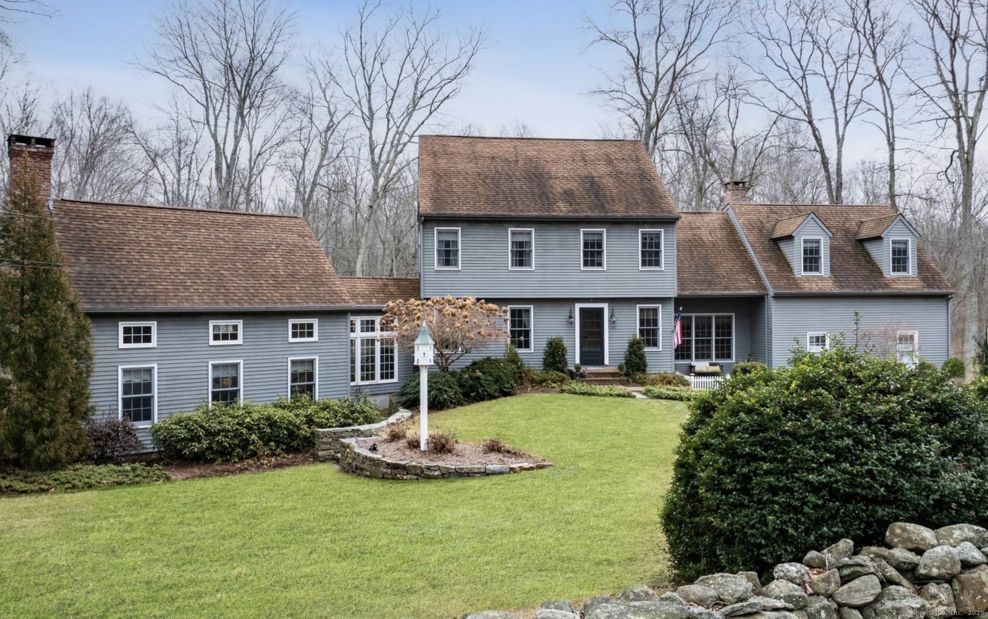 144 Old Horse Hill Road Westbrook, CT 06498 - Photo 1 of 1 a front view of a house with a yard table and chairs