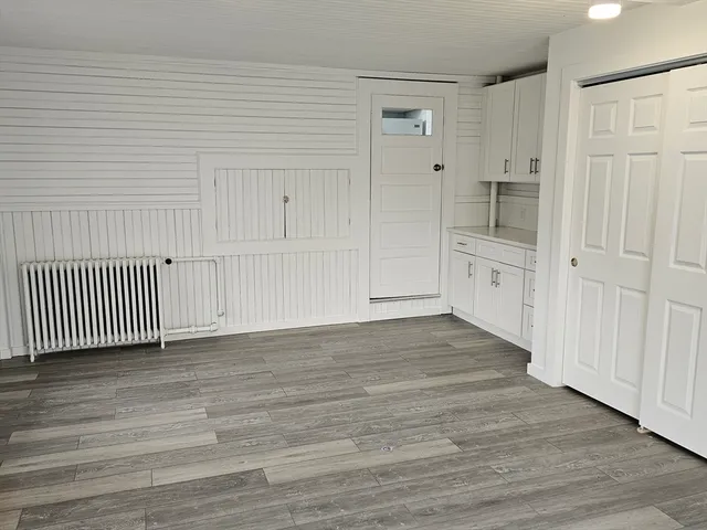 a kitchen with a sink cabinets and window