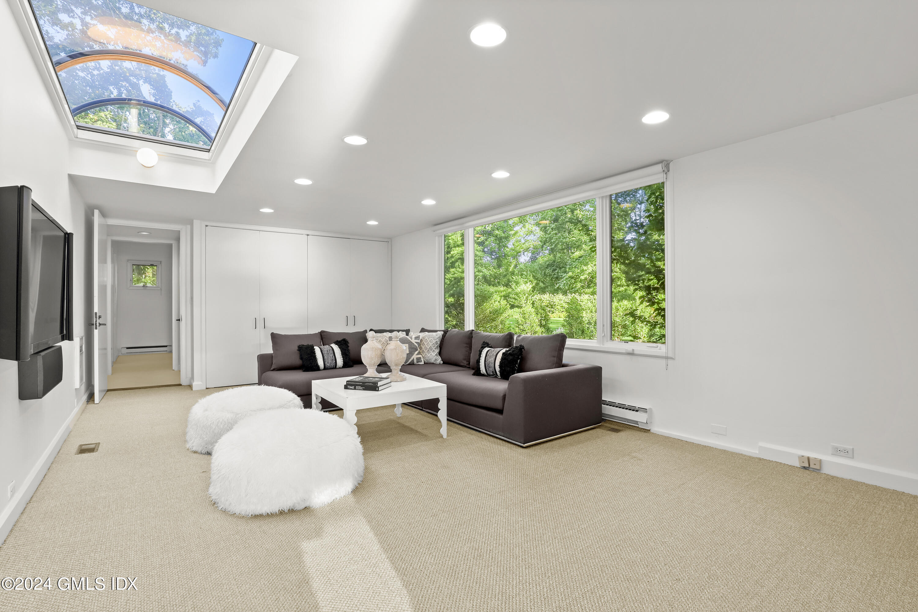 46 Carriglea Drive Riverside, CT 06878 - Photo 19 of 48 a living room with furniture and a large window