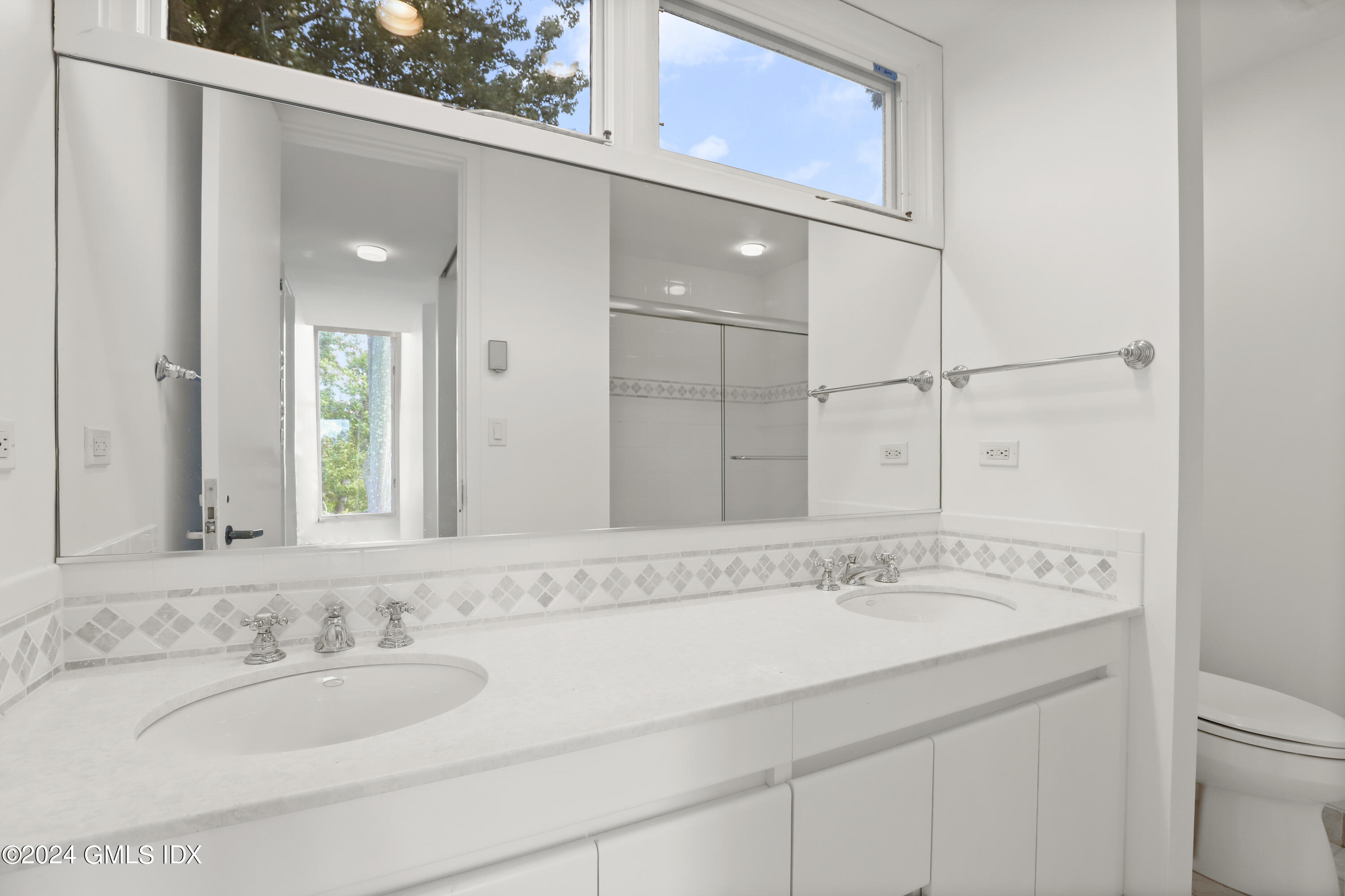 46 Carriglea Drive Riverside, CT 06878 - Photo 35 of 48 a bathroom with a granite countertop sink and a mirror