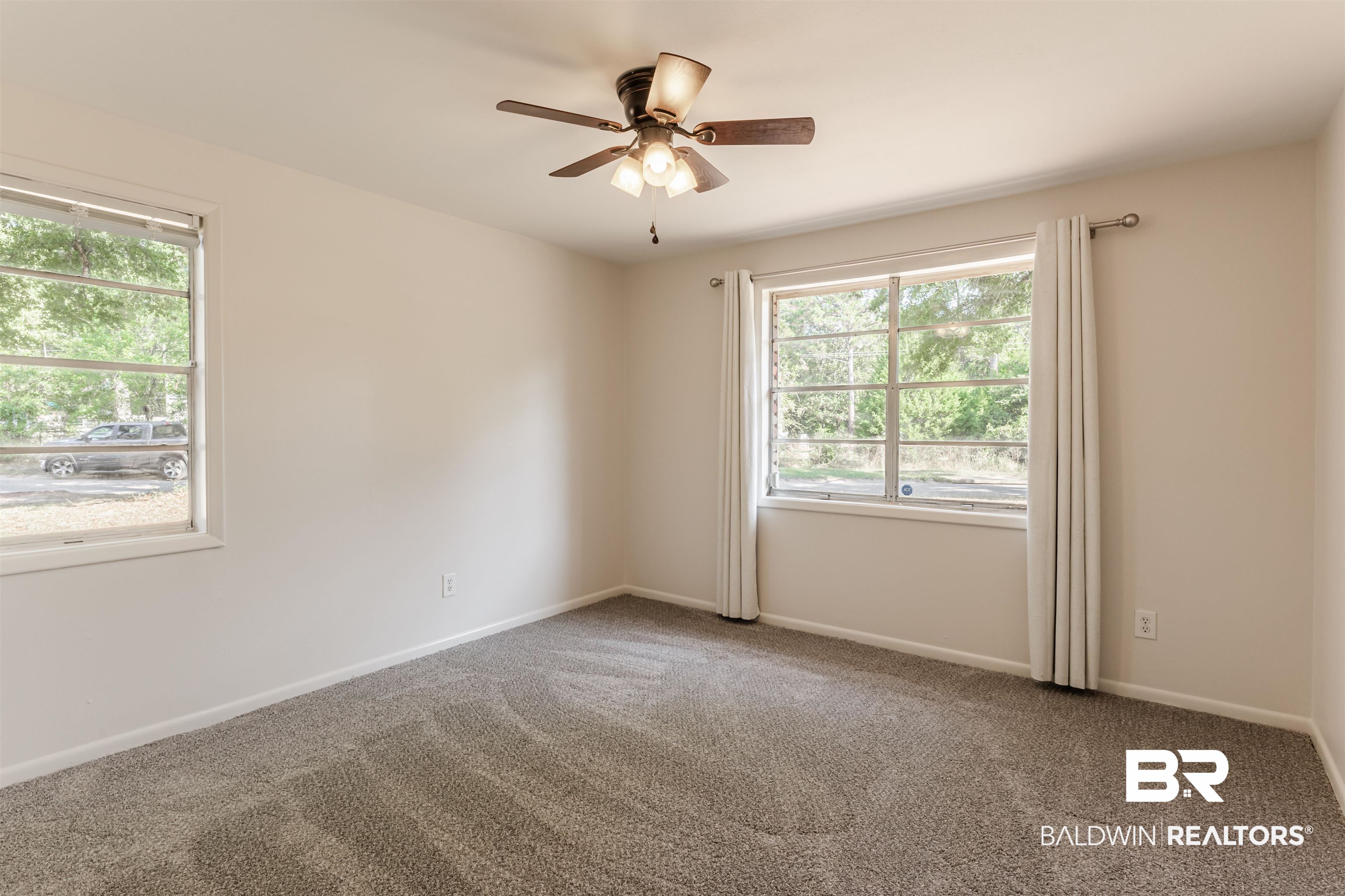 3970 Oak Ridge Avenue Mobile, AL 36619 - Photo 13 of 28 Spare room with ceiling fan, a wealth of natural light, and carpet floors