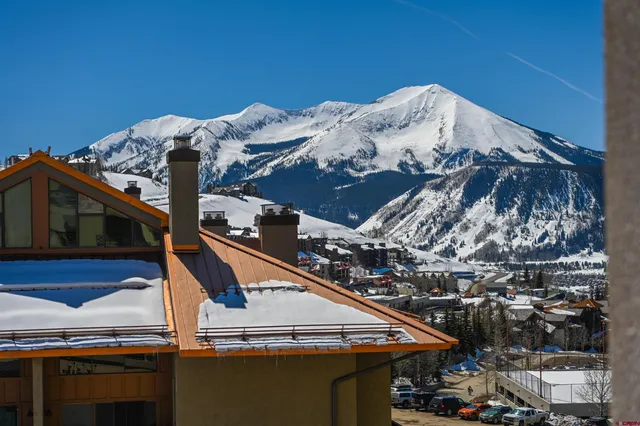 a view of a chair and table in the patio
