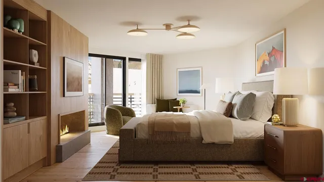 a bedroom with bed and wooden floor