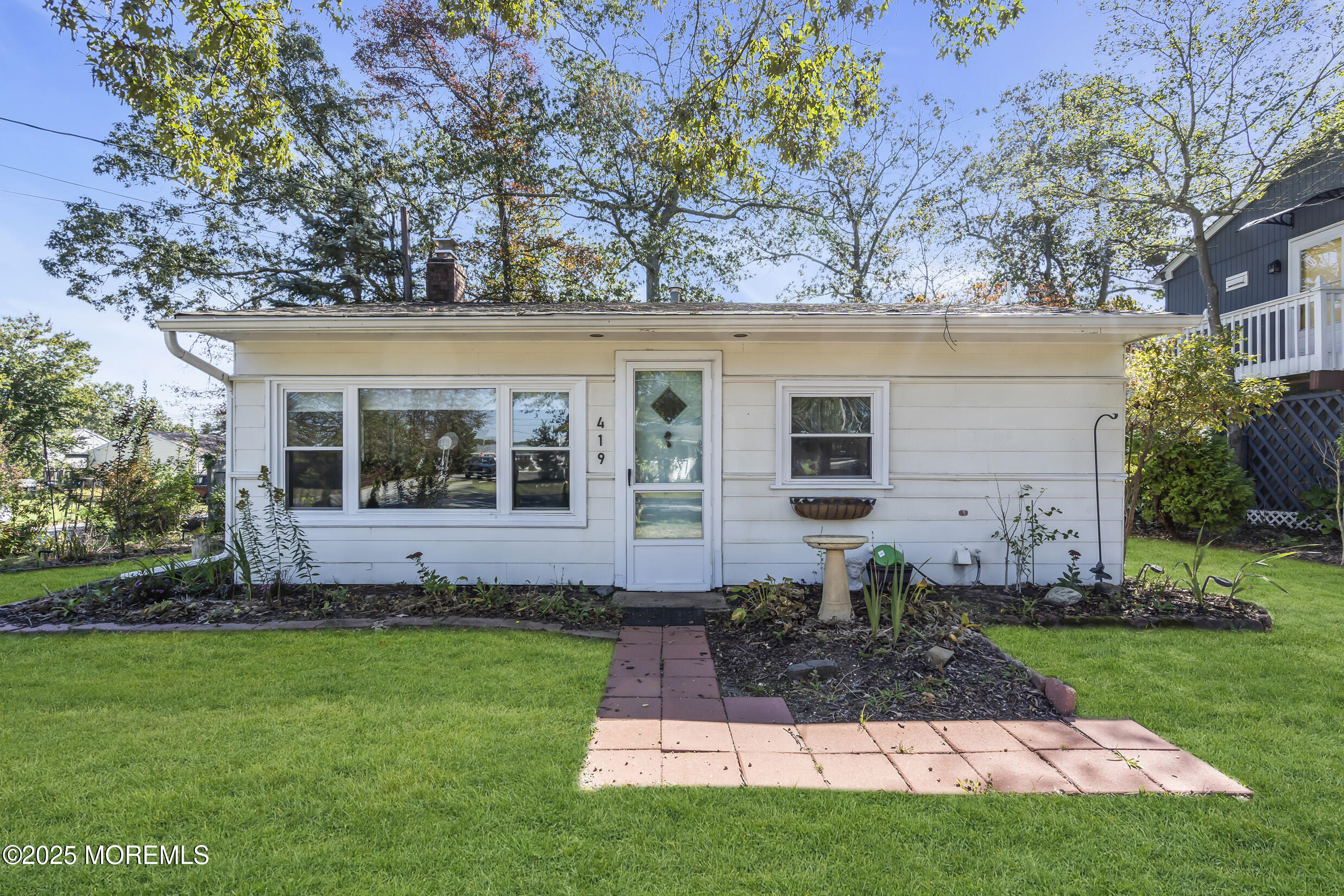 419 Beach Boulevard Forked River, NJ 08731 - Photo 1 of 21 front view of house with a yard