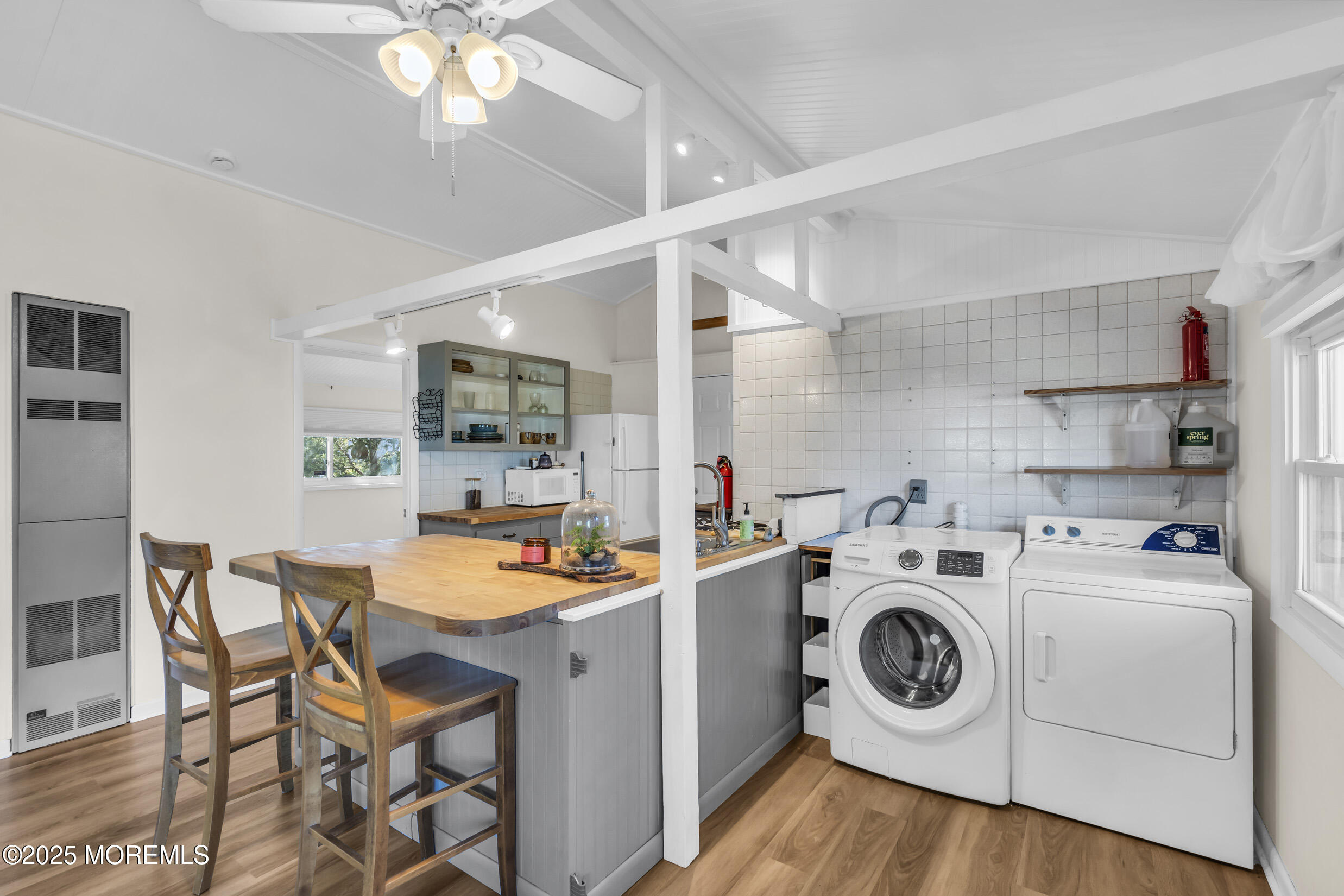 419 Beach Boulevard Forked River, NJ 08731 - Photo 11 of 21 a view of a kitchen filled with furniture and washer