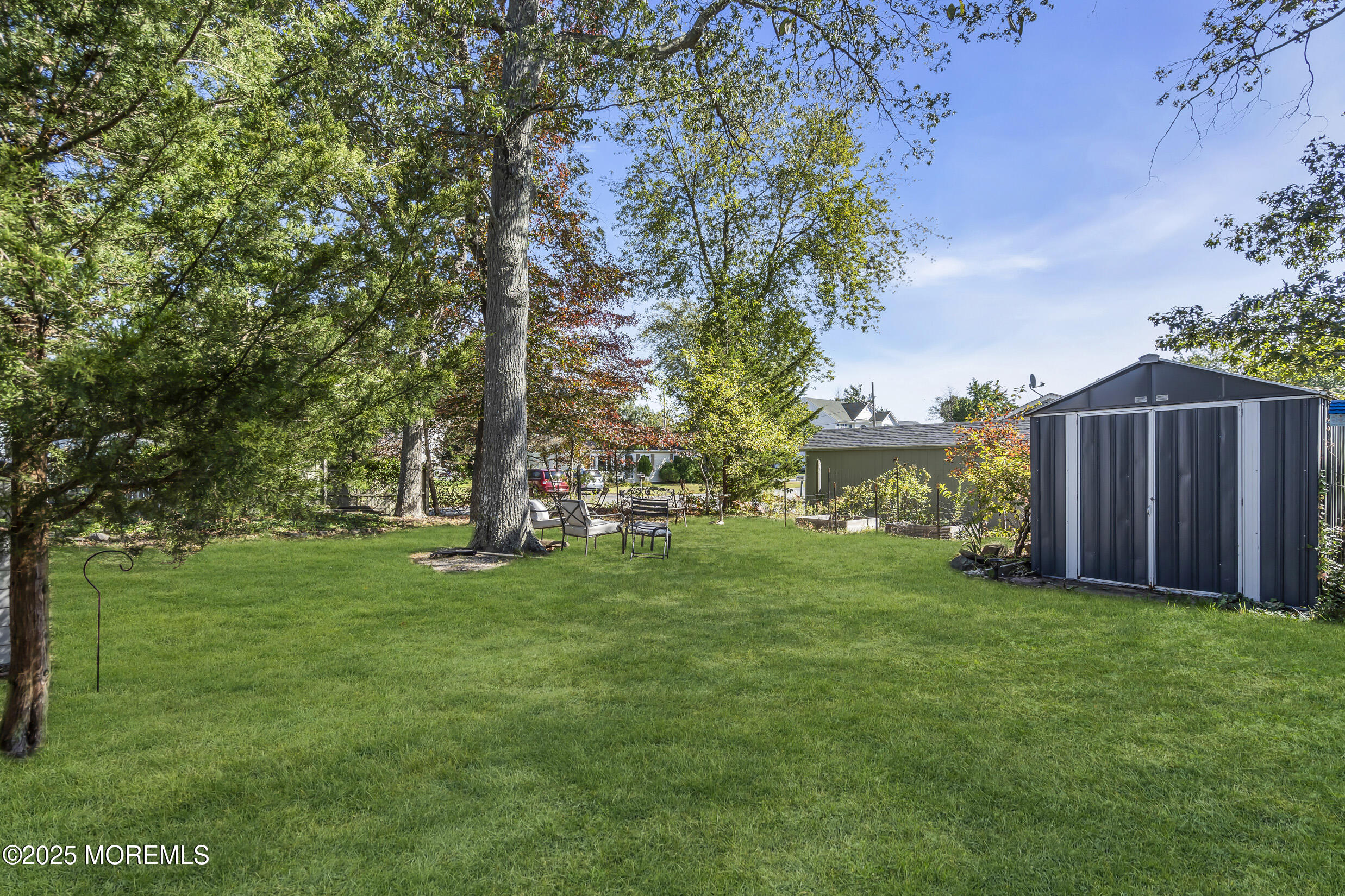 419 Beach Boulevard Forked River, NJ 08731 - Photo 17 of 21 a view of a backyard with large trees