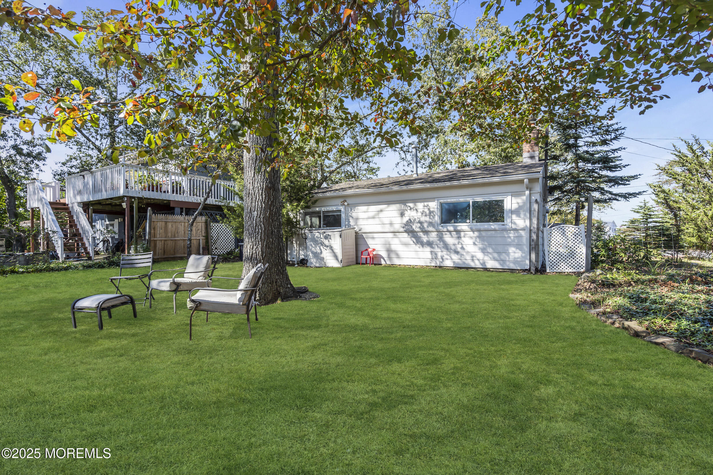 419 Beach Boulevard Forked River, NJ 08731 - Photo 20 of 21 a view of a house with backyard sitting area and garden