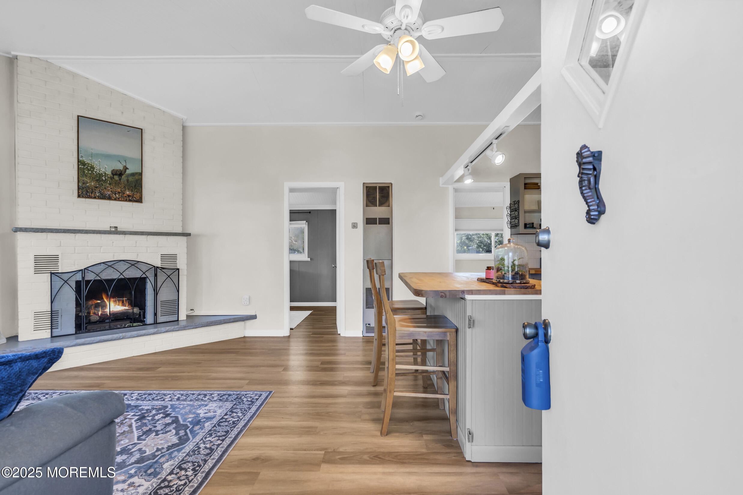 419 Beach Boulevard Forked River, NJ 08731 - Photo 3 of 21 a living room with furniture and a fireplace