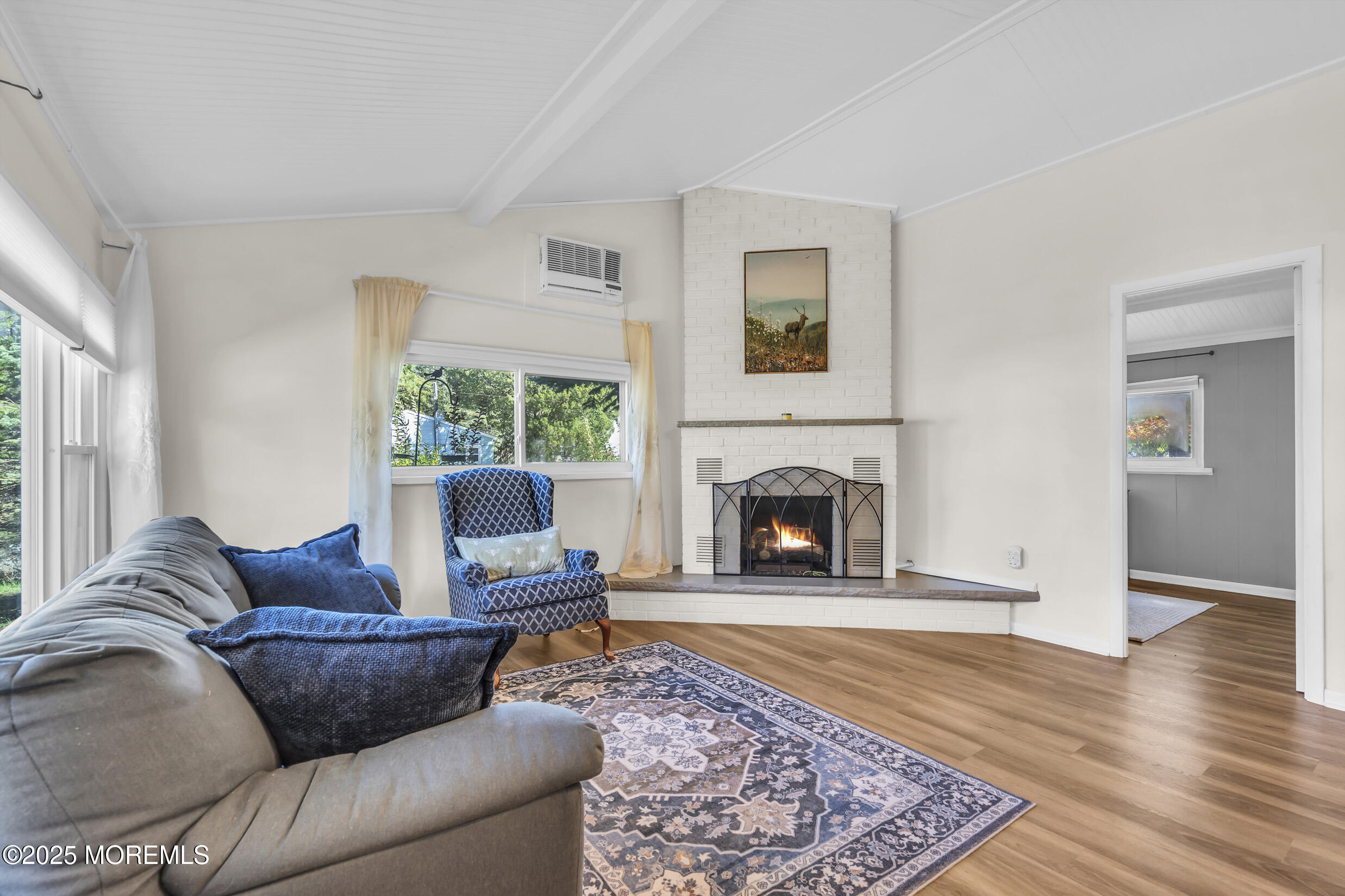 419 Beach Boulevard Forked River, NJ 08731 - Photo 4 of 21 a living room with furniture and a fireplace