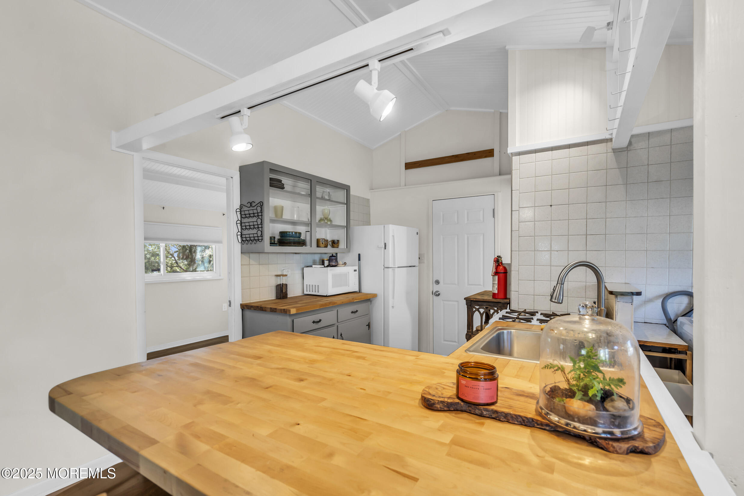 419 Beach Boulevard Forked River, NJ 08731 - Photo 6 of 21 a bedroom with a bed and gym equipment