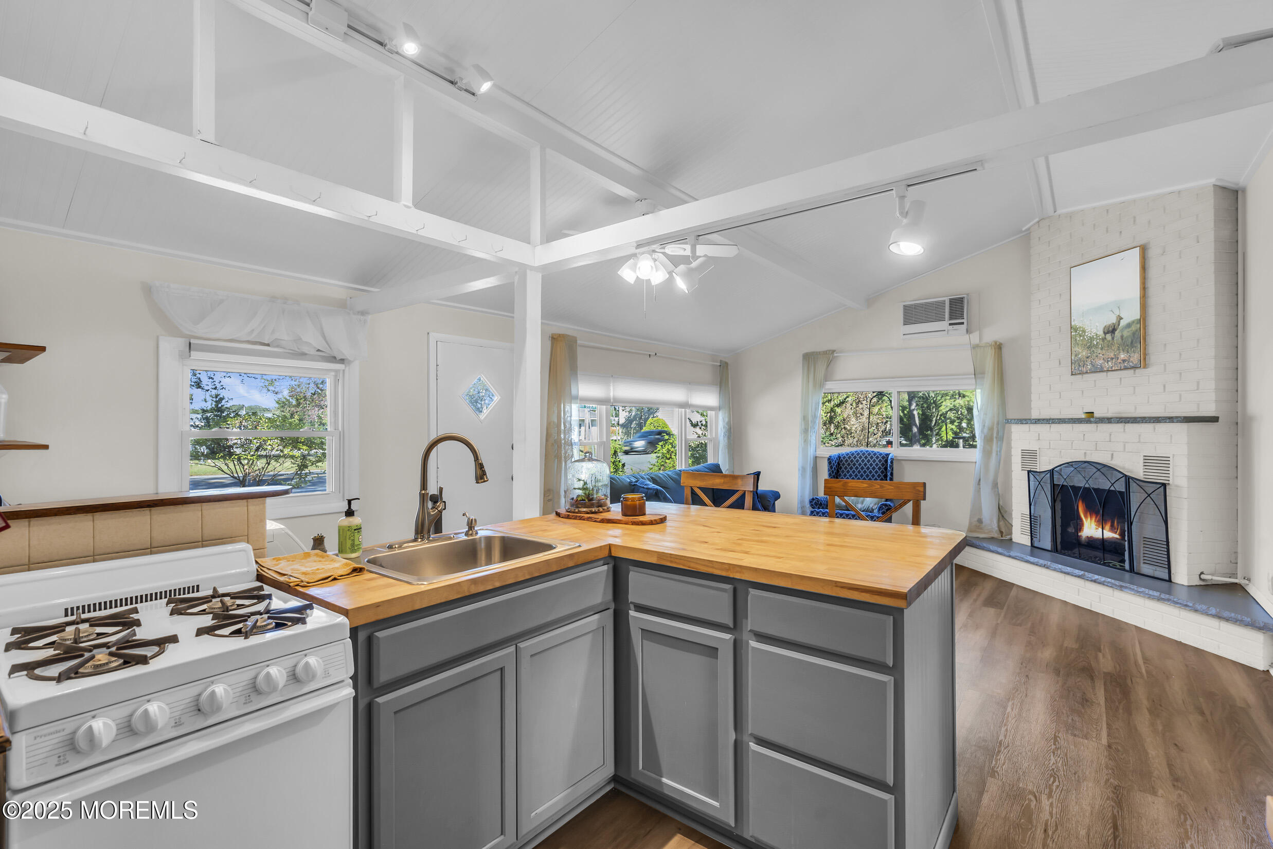 419 Beach Boulevard Forked River, NJ 08731 - Photo 9 of 21 a kitchen with a sink stove and cabinets