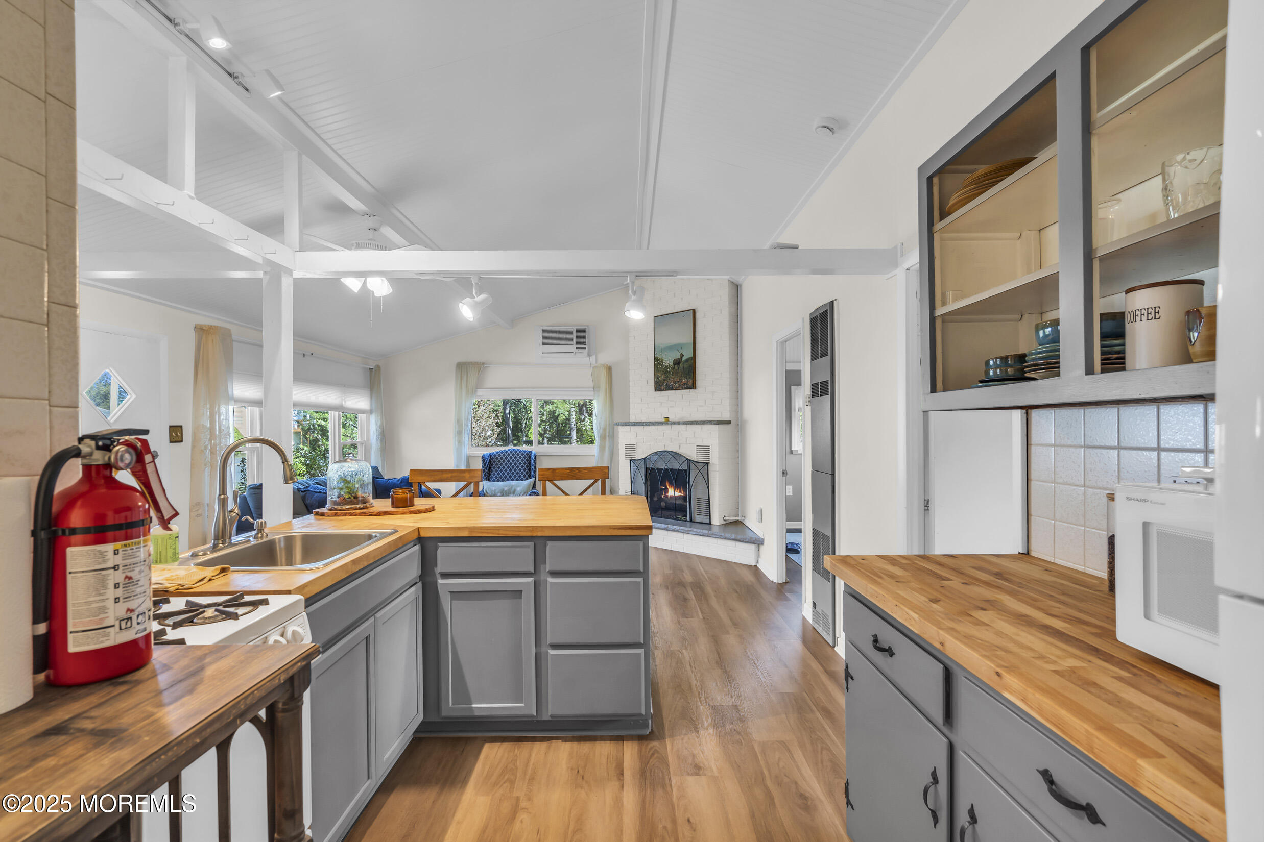419 Beach Boulevard Forked River, NJ 08731 - Photo 10 of 21 a kitchen with stainless steel appliances granite countertop a sink stove and refrigerator