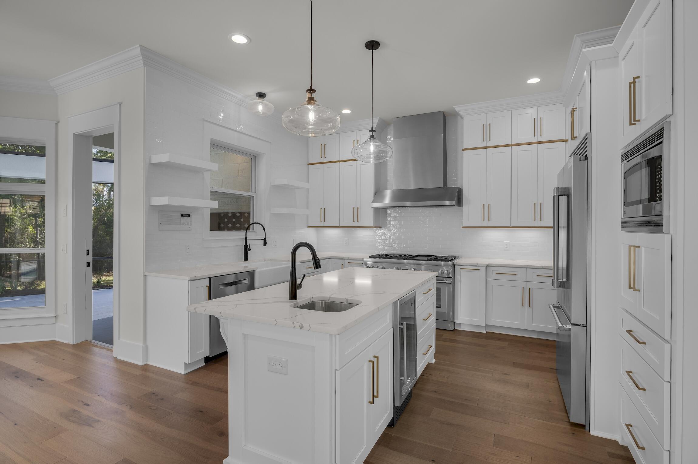 488 Regatta Bay Boulevard Destin, FL 32541 - Photo 14 of 46 a kitchen with kitchen island a sink stainless steel appliances and cabinets