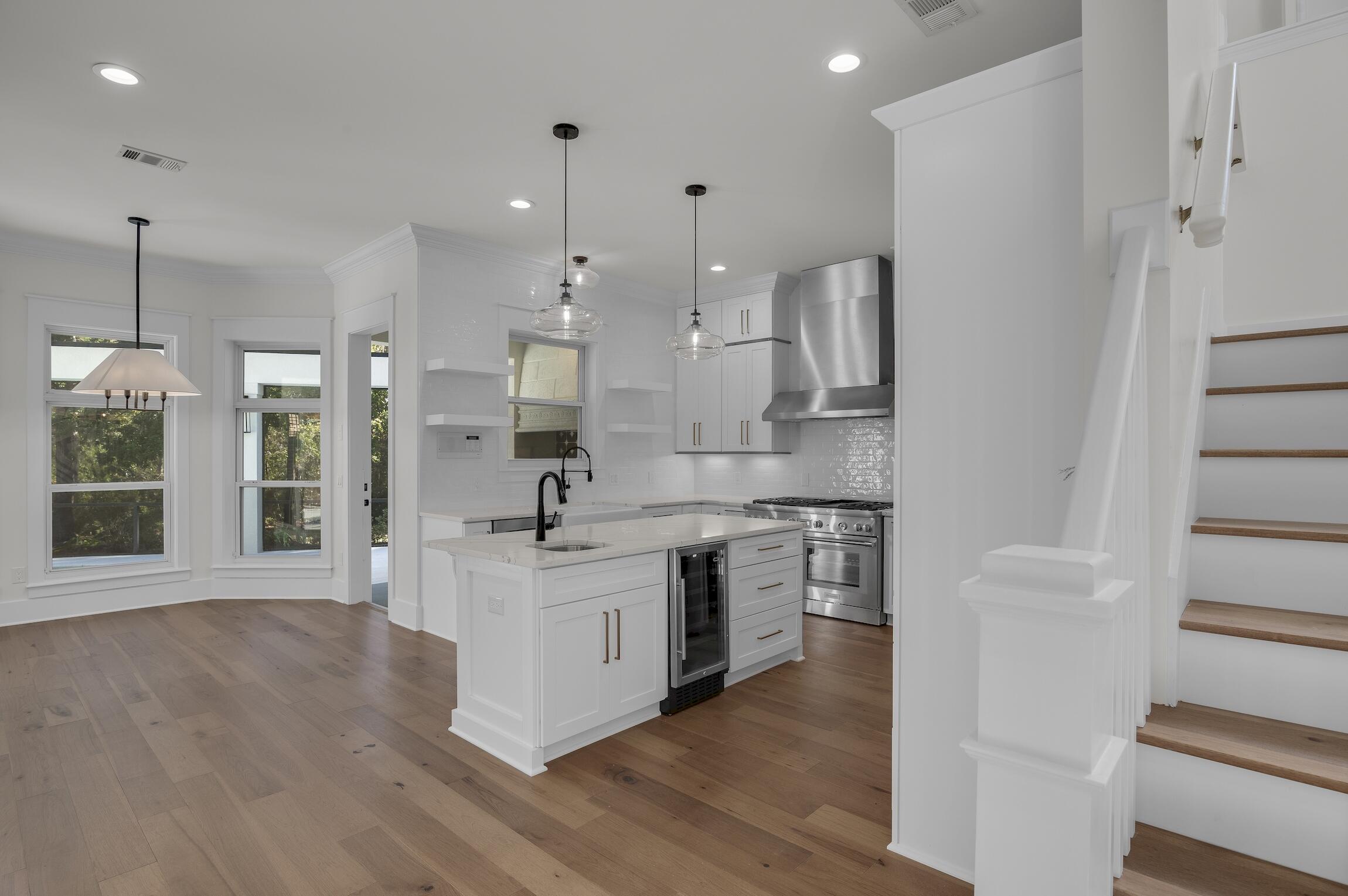 488 Regatta Bay Boulevard Destin, FL 32541 - Photo 18 of 46 a large kitchen with stainless steel appliances granite countertop a stove a sink and a refrigerator