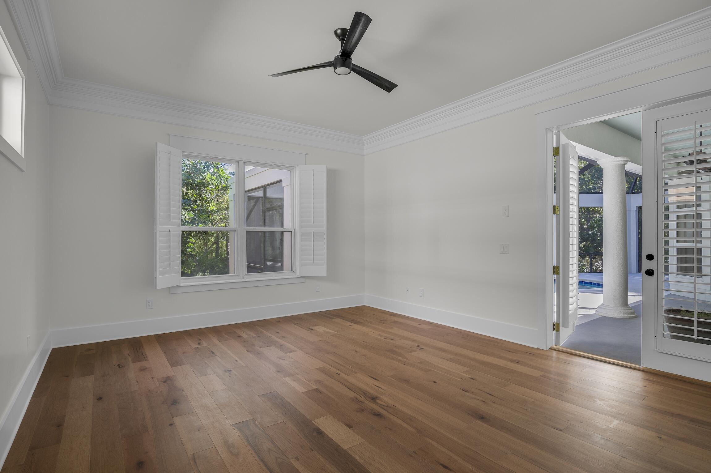 488 Regatta Bay Boulevard Destin, FL 32541 - Photo 20 of 46 a view of an empty room with wooden floor and a window