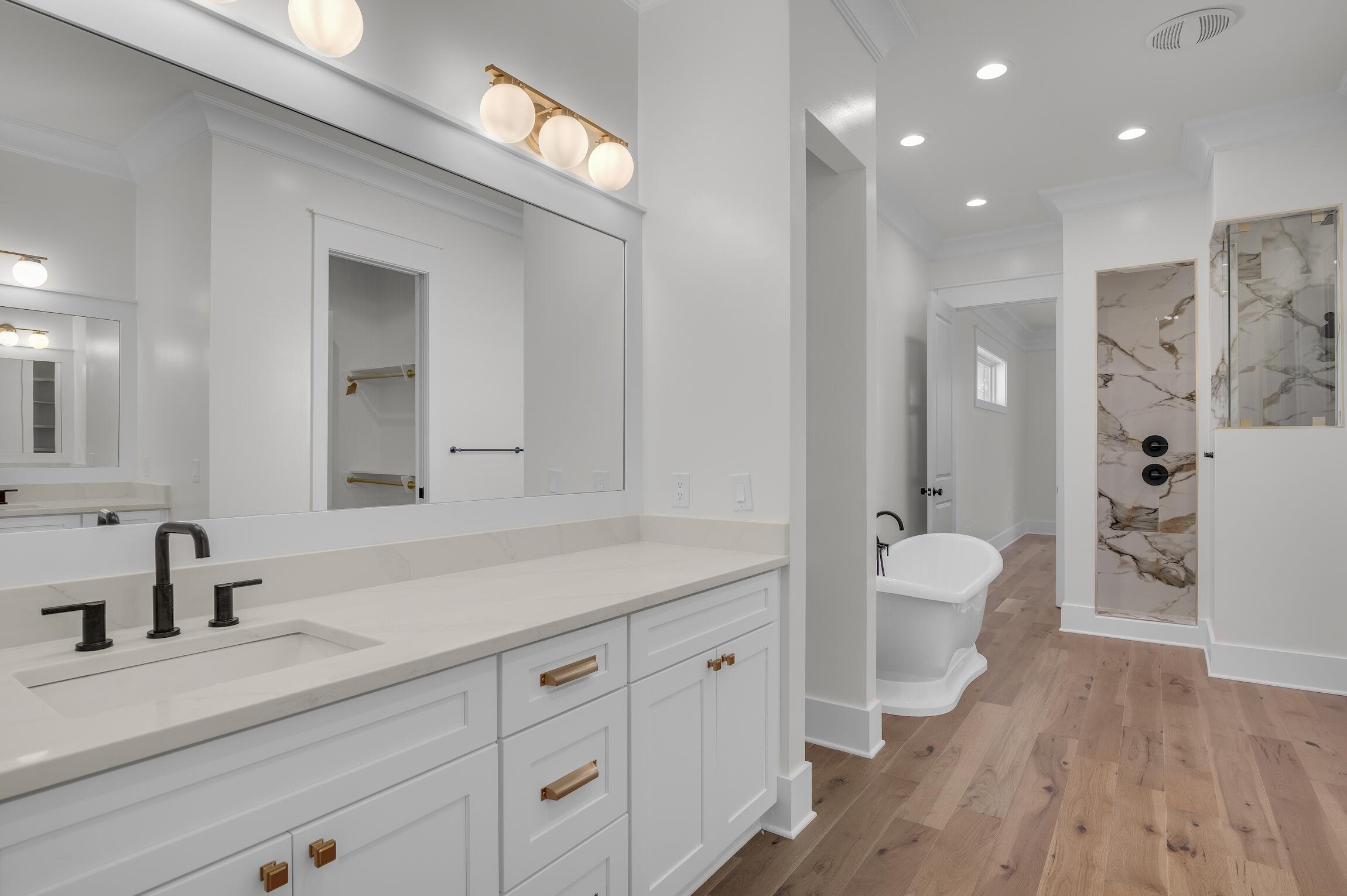 488 Regatta Bay Boulevard Destin, FL 32541 - Photo 22 of 46 a spacious bathroom with a double vanity sink mirror and toilet