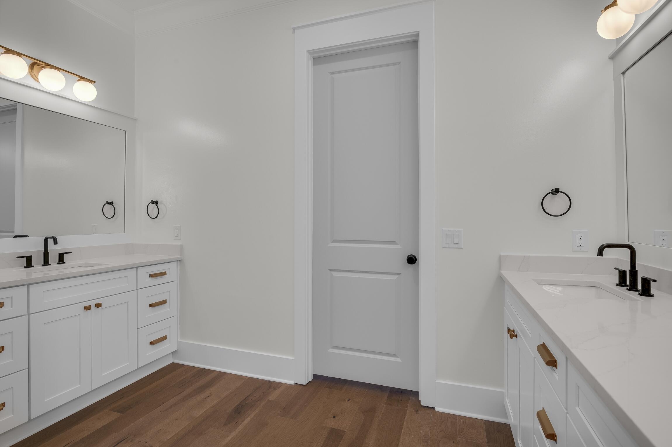 488 Regatta Bay Boulevard Destin, FL 32541 - Photo 24 of 46 a spacious bathroom with a double vanity sink and mirror