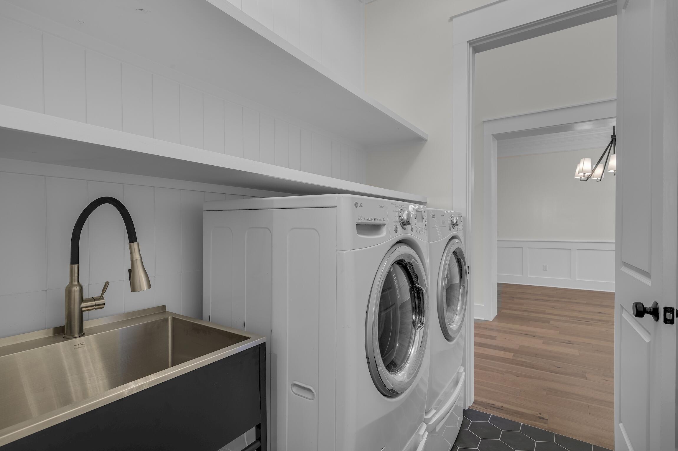 488 Regatta Bay Boulevard Destin, FL 32541 - Photo 26 of 46 a close view of a sink a washer and dryer