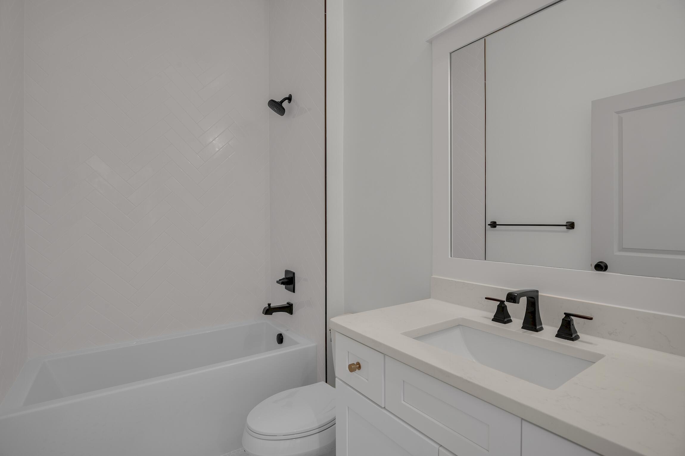 488 Regatta Bay Boulevard Destin, FL 32541 - Photo 35 of 46 a bathroom with a sink a toilet and bathtub