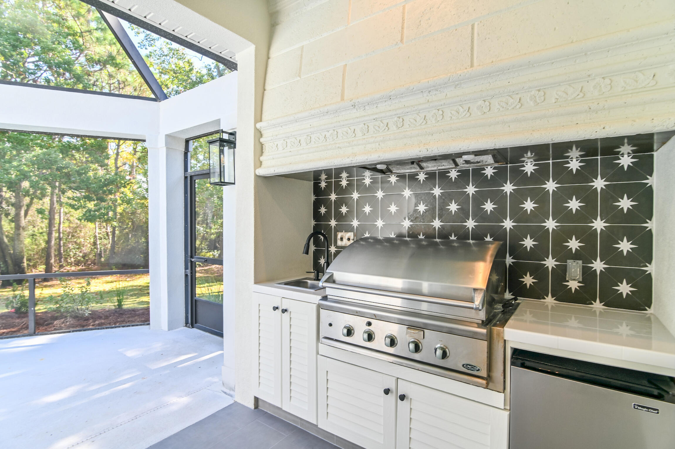 488 Regatta Bay Boulevard Destin, FL 32541 - Photo 40 of 46 a kitchen with a stove and a white cabinet